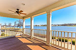 Upper level covered balcony offers panoramic lake views at 79 Waters View, Lucas Point at The Waters, Pike Road, AL. Professional photos and tour by Go2REasssistant.com