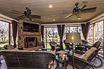 Screened porch overlooking the lake at 8048 Mossy Oak Drive in Eastern Forest, Montgomery, AL. I Shoot Houses...Professional photos and tour by Sherry Watkins at Go2REasssistant.com