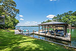 Large Boathouse and partially covered dock at 1304 Lakewood Drive, Dadeville, AL-Lake Martin AL Waterfront homes for sale. Professional photos and tour by Go2REasssistant.com