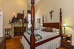 Bedroom with fireplace at Prairie Place, Historic Estate, Hope Hull, AL. Professional photos and tour by Go2REasssistant.com