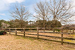 One of the street side fenced pastures at 984 Muskgokee Trail, Tallassee, AL. Professional photos and tour by Go2REasssistant.com