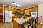 Bright open Kitchen at 984 Muskgokee Trail, Tallassee, AL. Professional photos and tour by Go2REasssistant.com