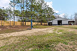 Horse exercise walker at 984 Muskgokee Trail, Tallassee, AL. Professional photos and tour by Go2REasssistant.com