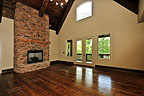 Greatroom with fireplace and beautiful wood floors at 480 Hickory Trail in River Oaks, Lake Martin - Alexander City,  AL. Professional photos and tour by Go2REasssistant.com