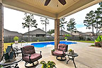 Pool view from covered patio at 9033 Black Cherry Trail, Pike Road, AL. Professional photos and tour by Go2REasssistant.com