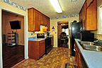 Walk-thru kitchen at 106 Blushing Groom in Taylor Crossing, Montgomery, AL. Professional photos and tour by Go2REasssistant.com