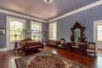 A 2nd floor bedroom with private bath at Kenworthy-Carlisle Hall, Historic Estate Ranch, Marion, AL. Professional photos and tour by Go2REasssistant.com