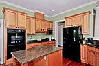 Open kitchen with breakfast nook and island breakfast bar at 49 Oaks Point in River Oaks, Lake Martin - Alexander City,  AL. Professional photos and tour by Go2REasssistant.com