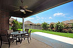Huge covered patio overlloks beautifully landscaped yard at 8207 Stonewall Ct in Sturbridge, Montgomery, AL. Professional photos and tour by Go2REasssistant.com