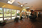 Bright sunroom overlooks yard and woods at 6417 Wynwood Place, Montgomery, AL. Professional photos and tour by Go2REasssistant.com